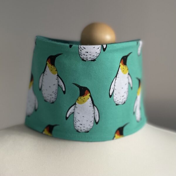 Penguin design neck warmer lined with organic fleece