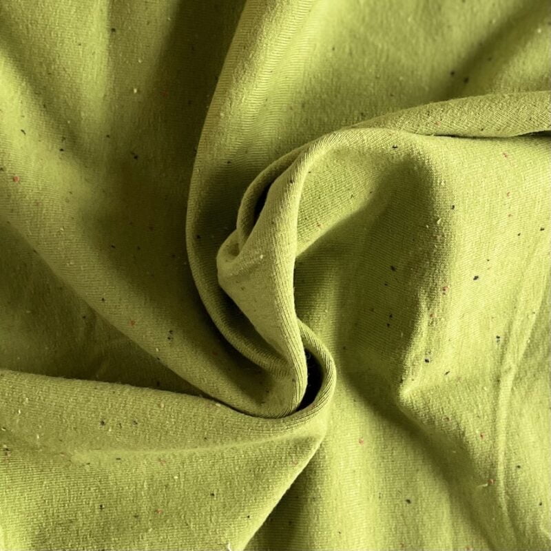 pistachio colour cotton jersey with confetti flecks